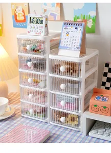 Multi-layer white desktop organizer with transparent fluted drawers in lifestyle setting