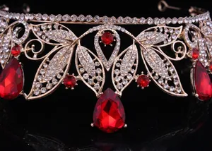 Close-up macro detail of a vintage Baroque bridal crown with red teardrop rhinestones