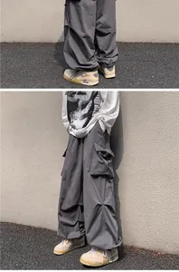 Detailed macro view of American vintage grey cargo pants with drawstring cuffs