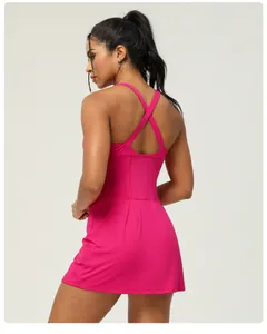 Back view of hot pink quick-dry athletic dress with cross straps and open back design