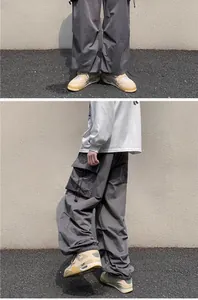 Vintage loose techwear cargo pants with adjustable drawstring cuff and side flap pockets