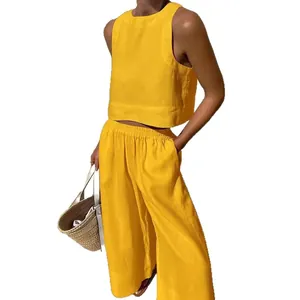 Vibrant yellow two-piece casual set featuring a sleeveless crop top and wide leg pants