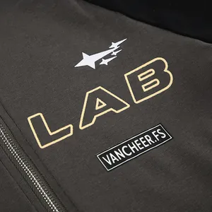 Close-up detail of the 'LAB' letter print and zipper on a cropped motorcycle top.