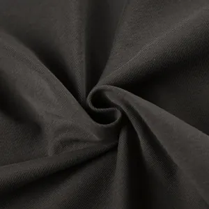 Detailed macro shot of dark grey knit fabric texture for slim fit streetwear top