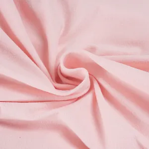 Detailed macro view of soft pink knit fabric texture for casual streetwear sets