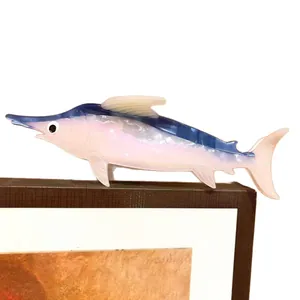 Elegant pearlescent marlin acetate hair claw clip with blue and pink gradient finish.