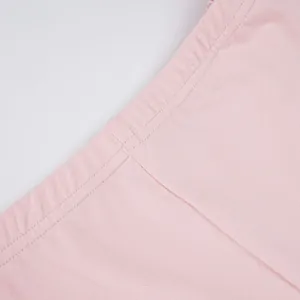 Close-up of pink sports shorts waistband showing high-quality fabric and stitching detail.