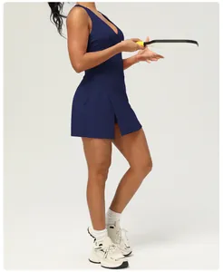 Side view of navy blue backless sports dress with built-in shorts and chest pads