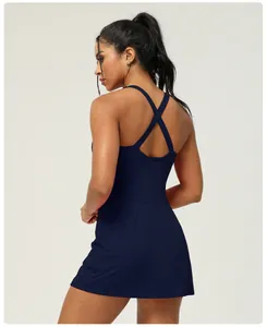Back view of navy blue athletic tennis dress with cross-back straps and built-in shorts
