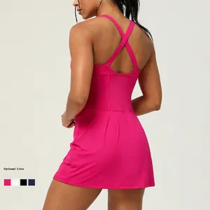Sporty hot pink sleeveless backless yoga dress with cross straps and built-in bra