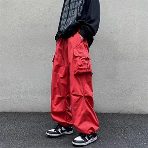 Vintage red wide-leg cargo pants with drawstring hem for high-street techwear style