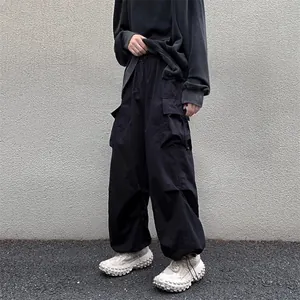 Stylish black vintage high street loose fit cargo pants with drawstring cuffs for men