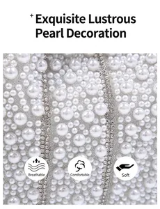 Close-up detail of luxury pearl and rhinestone embellishment on evening clutch bag