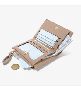 Close-up of beige short wallet interior with multiple card slots and zipper pocket.