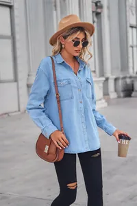 Model street style featuring a light blue long-sleeve denim shirt with breast pockets