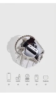Close-up of pearl rhinestone evening bucket bag showing spacious interior storage capacity