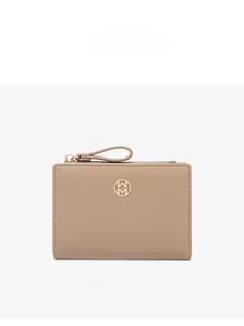 Close-up of apricot bi-fold women's wallet with gold circular logo detail