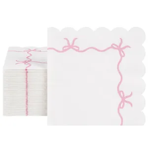Tovaglioli di carta bianchi per feste con fiocchi rosa e bordi smerlati decorati