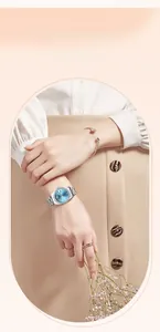 Detailed shot of an elegant silver women's watch with blue dial and matching bracelet set