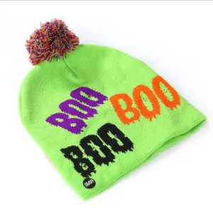 Neon green Halloween LED light-up beanie with colorful pom-pom and BOO letter design