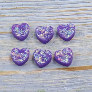 Purple resin heart beads with iridescent synthetic opal flakes for DIY jewelry making.