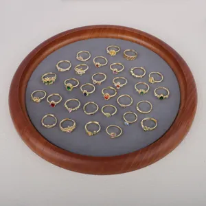 Detailed macro view of assorted French vintage gold-plated adjustable rings on a display tray