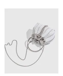 Elegant white pearl beaded evening bag with shell shape and silver circular handle
