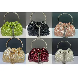 Collection of sequined bucket evening bags with metal ring handles in six vibrant colors.
