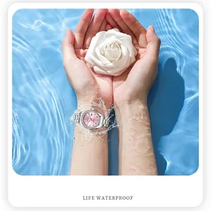 Women's diamond-encrusted quartz watch with pink dial and silver steel band in water