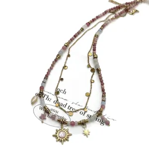 Multilayer colorful beaded necklace featuring bohemian sun and star pendant charms