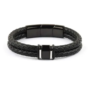 Close-up of double-layer braided black leather bracelet with magnetic clasp.