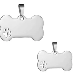 Detailed view of bone-shaped stainless steel pet ID tags with hollow paw print