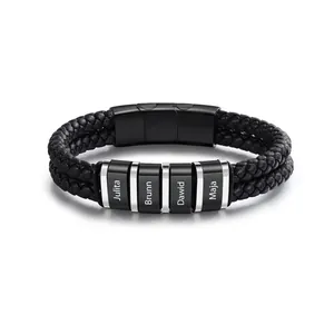 Detail view of personalized black braided leather bracelet with engraved name beads