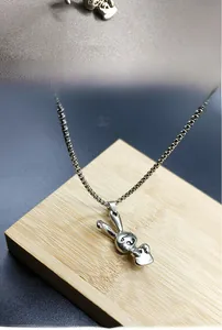 Close-up detail of a hip-hop style rabbit pendant on a durable stainless steel chain
