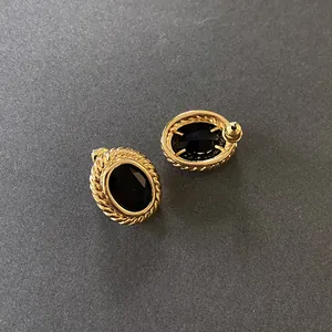 Elegant French vintage oval black gemstone stud earrings with gold twisted edge detail