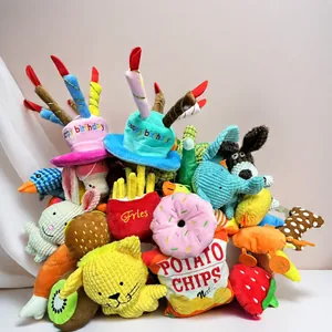 Assorted colorful plush squeaky dog toys including birthday hats and food shapes