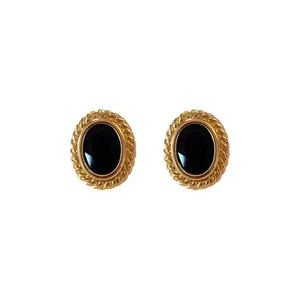 Elegant French retro gold-plated oval earrings with faceted black gemstones