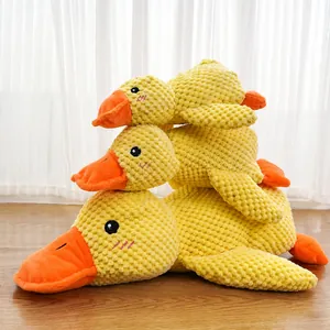 Three-piece set of yellow plush squeaky duck dog toys for dental health and play