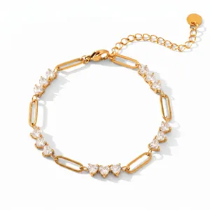 Detailed view of gold-plated titanium steel bracelet with heart-shaped white gems