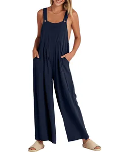 Mono informal de algodón y lino azul marino con pernera ancha, bolsillos y tirantes con botón