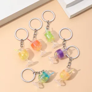 Colorful luminous beverage goblet keychains with lemon slices and striped straws