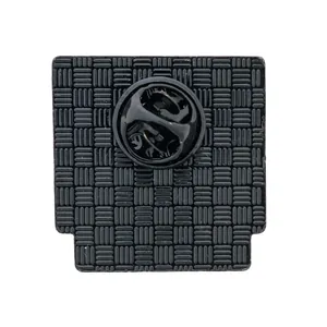 Detailed back view of black video game console enamel pin with textured metal surface