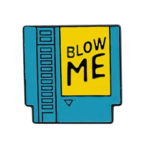 Creative retro blue game cartridge enamel pin featuring a yellow Blow Me label for backpacks
