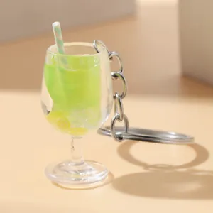 Luminous green beverage goblet keychain with simulation lemon slices and striped straw detail