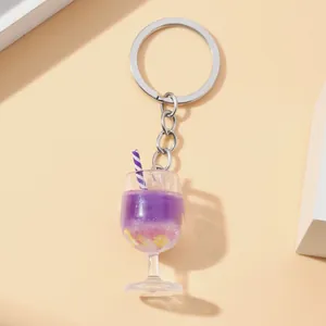 Detail macro view of purple drink goblet keychain with mini lemon slices and straw