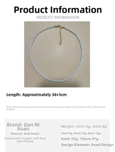 Detailed view of a classic white pearl necklace with adjustable gold-finished chain clasp.