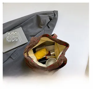Large capacity corduroy strawberry print tote bag showing internal storage details