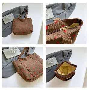 Multi-angle details of brown corduroy tote bag with strawberry print and gold zipper