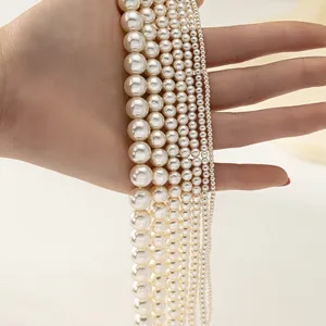 Close-up view of graduated cream pearl necklace strands in multiple sizes for jewelry