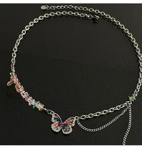 Close-up of colorful rhinestone butterfly necklace with crushed stones and layered chains
